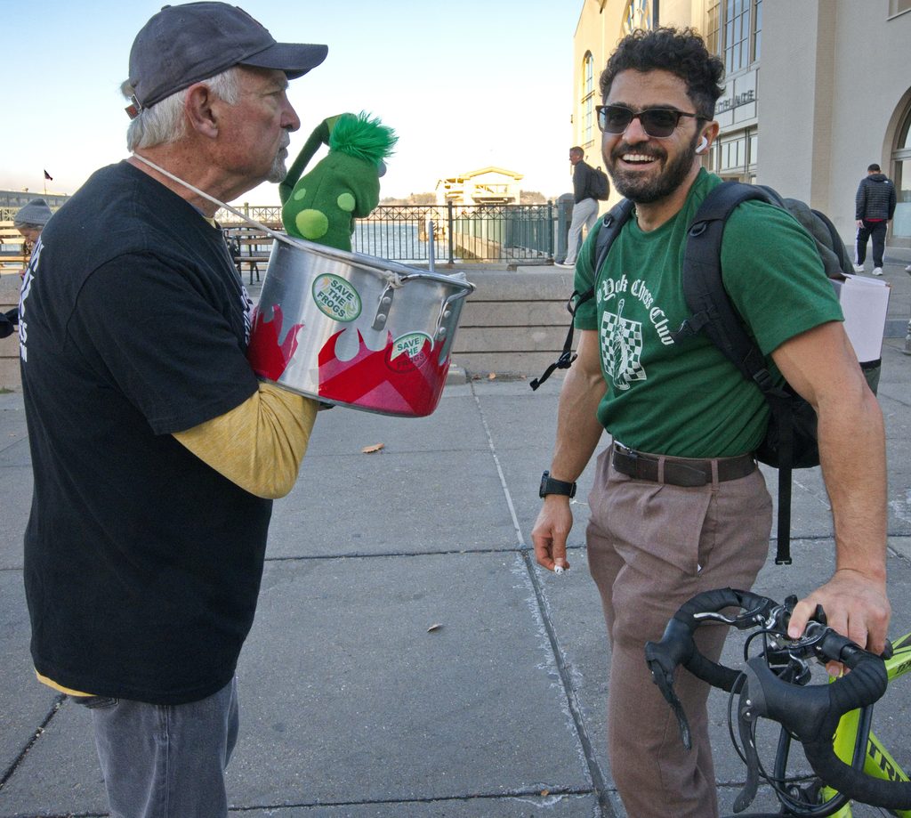 doug and frog puppet with passerby